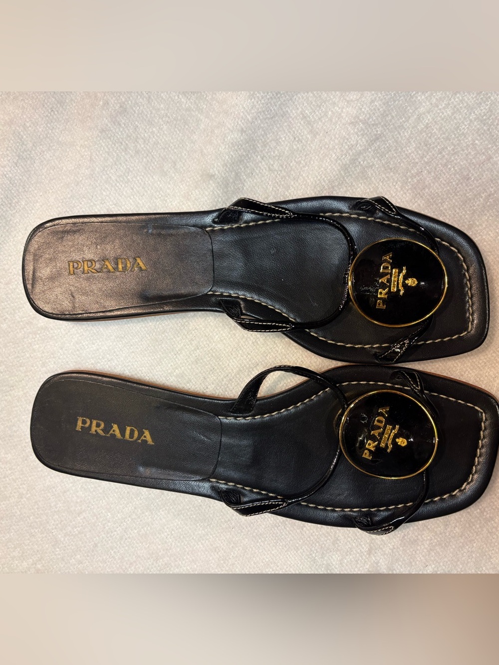 Prada Black Leather Thong Sandals with Gold Logo Medallion